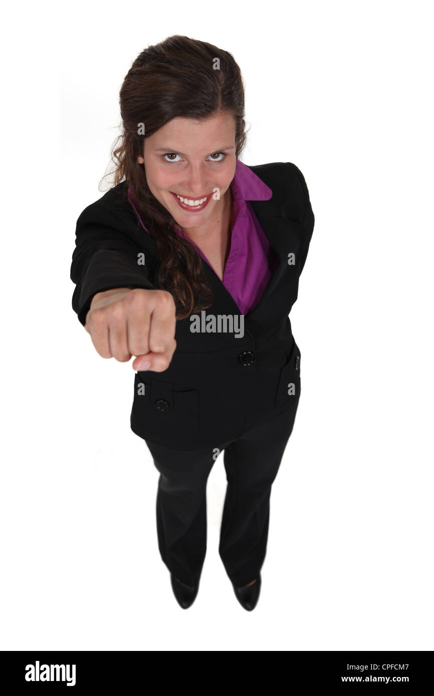 successful businesswoman raising her fist Stock Photo