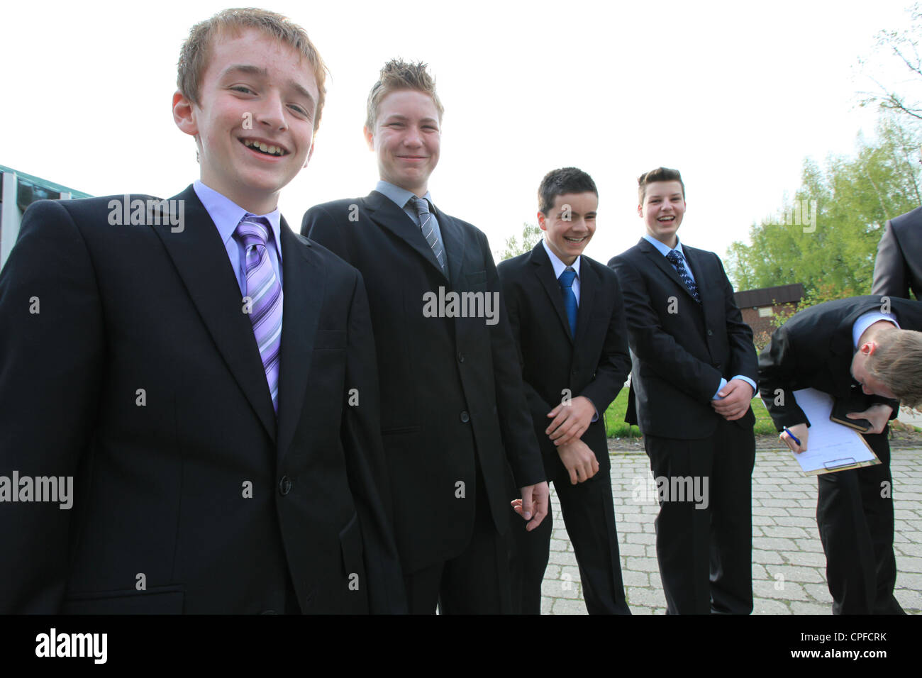 Boys with suits and ties pose for a group photo while waiting for the protestant confirmation ceremony, Germany Stock Photo