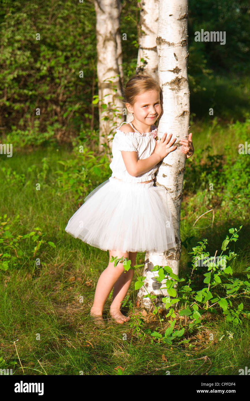 Beautiful girl in the forest outdoor Stock Photo - Alamy