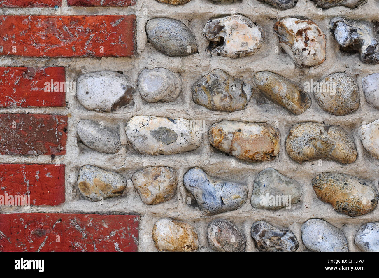 Flint cobbles used in conjunction with brickwork. Stock Photo