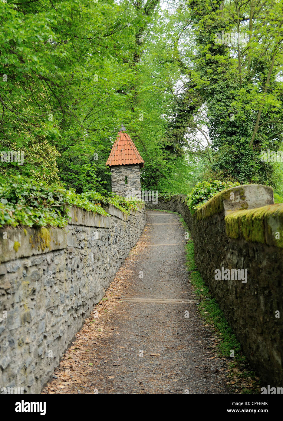 Old castle stone path in big garden. Stock Photo