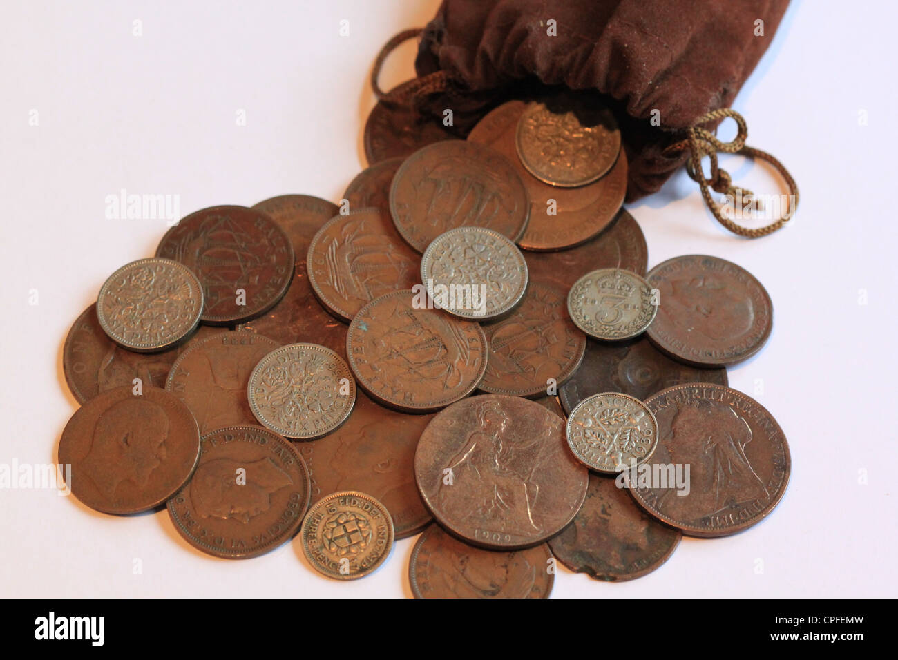 Old British coins in a bag Stock Photo Alamy