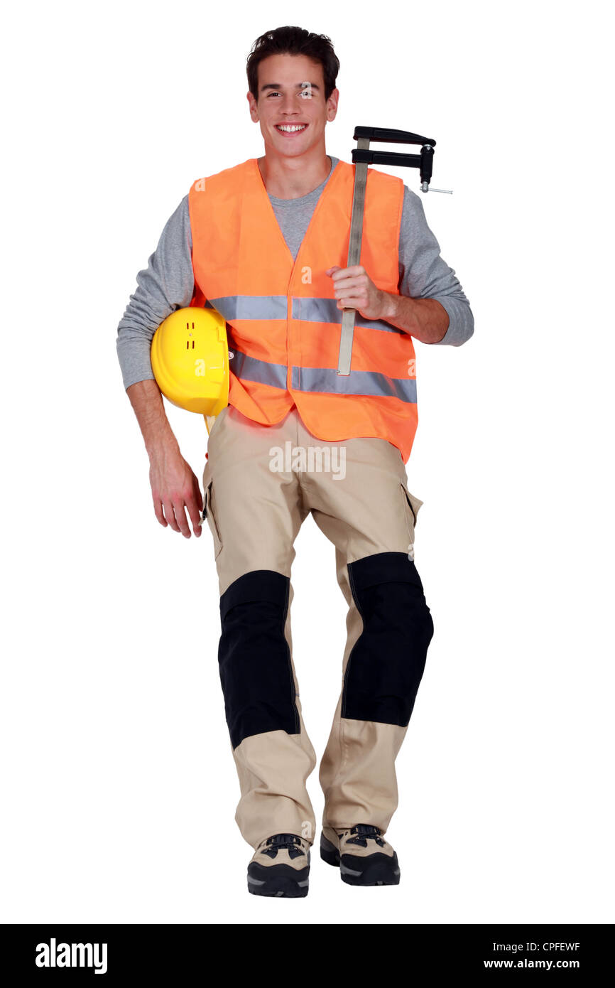 Worker with an F clamp Stock Photo