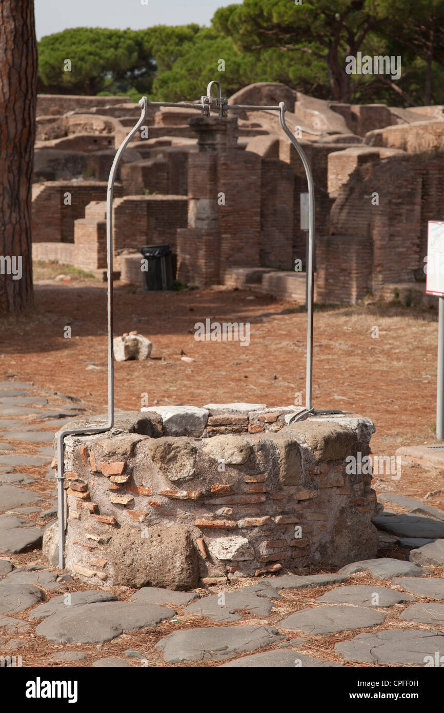 Well on the Decumanus at The ancient roman port town ruin of Ostia near Rome Stock Photo