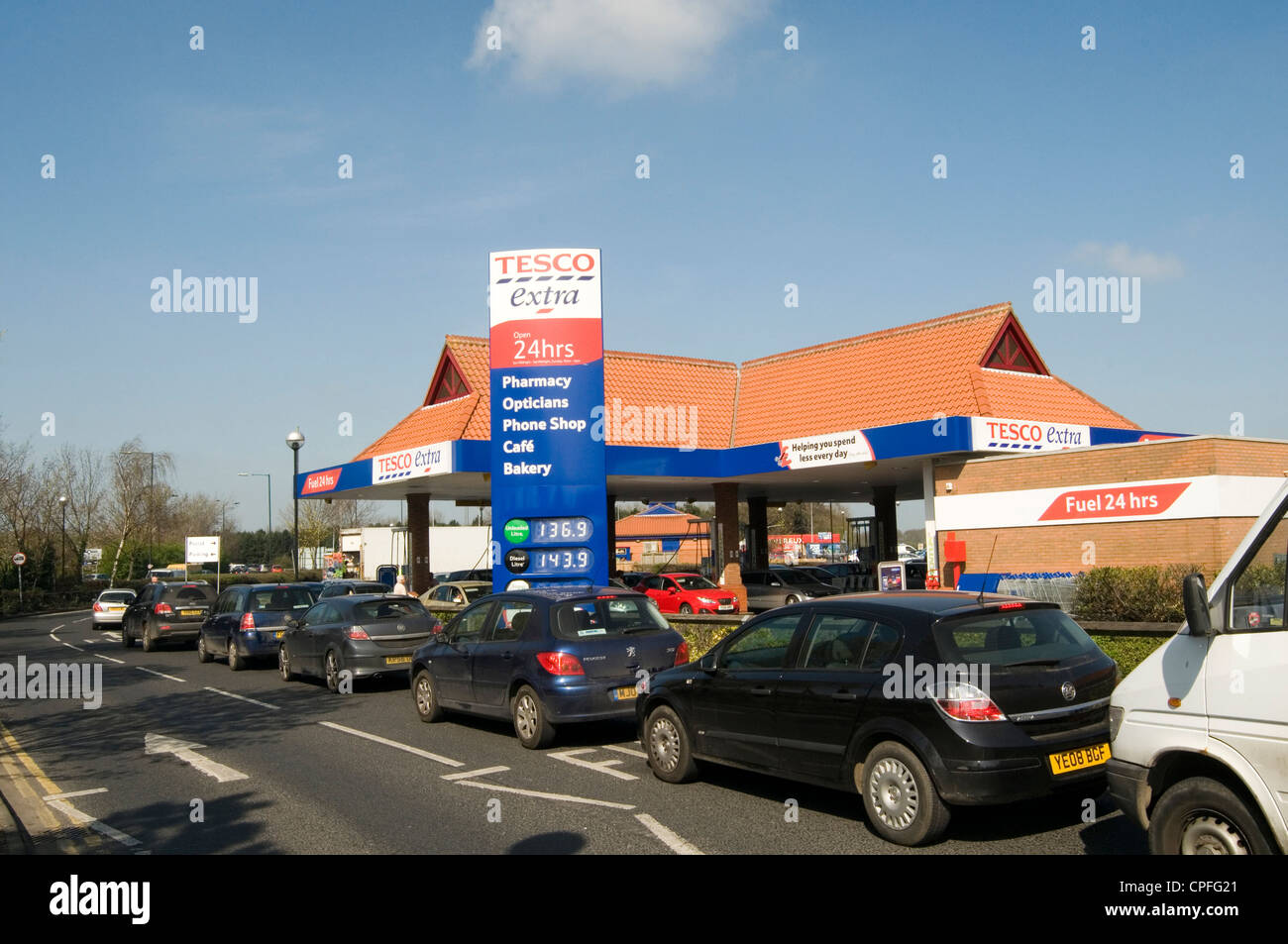 car cars que queing for petrol at tesco fuel station diesel ques