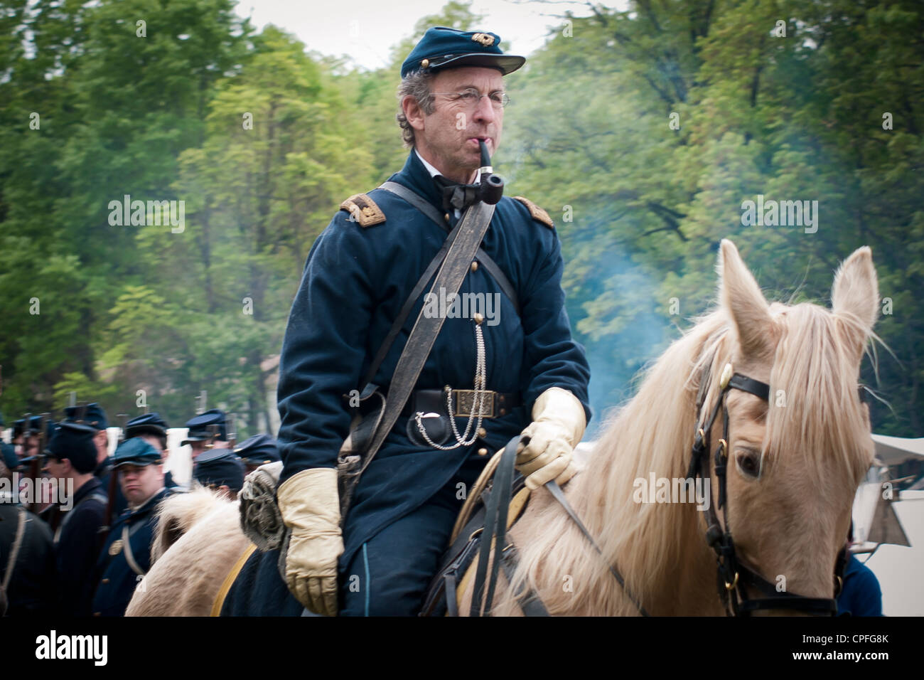 A Union Army officer with pipe sitting on the warhorse, Civil War reenactment, Bensalem