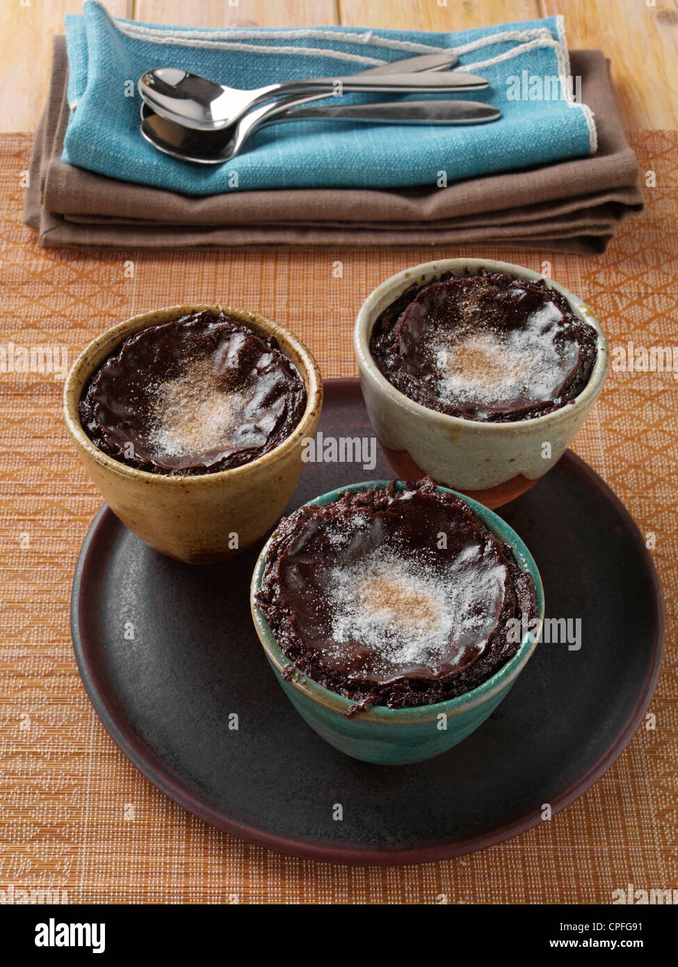 Individual portions of banana fudge pudding Stock Photo Alamy