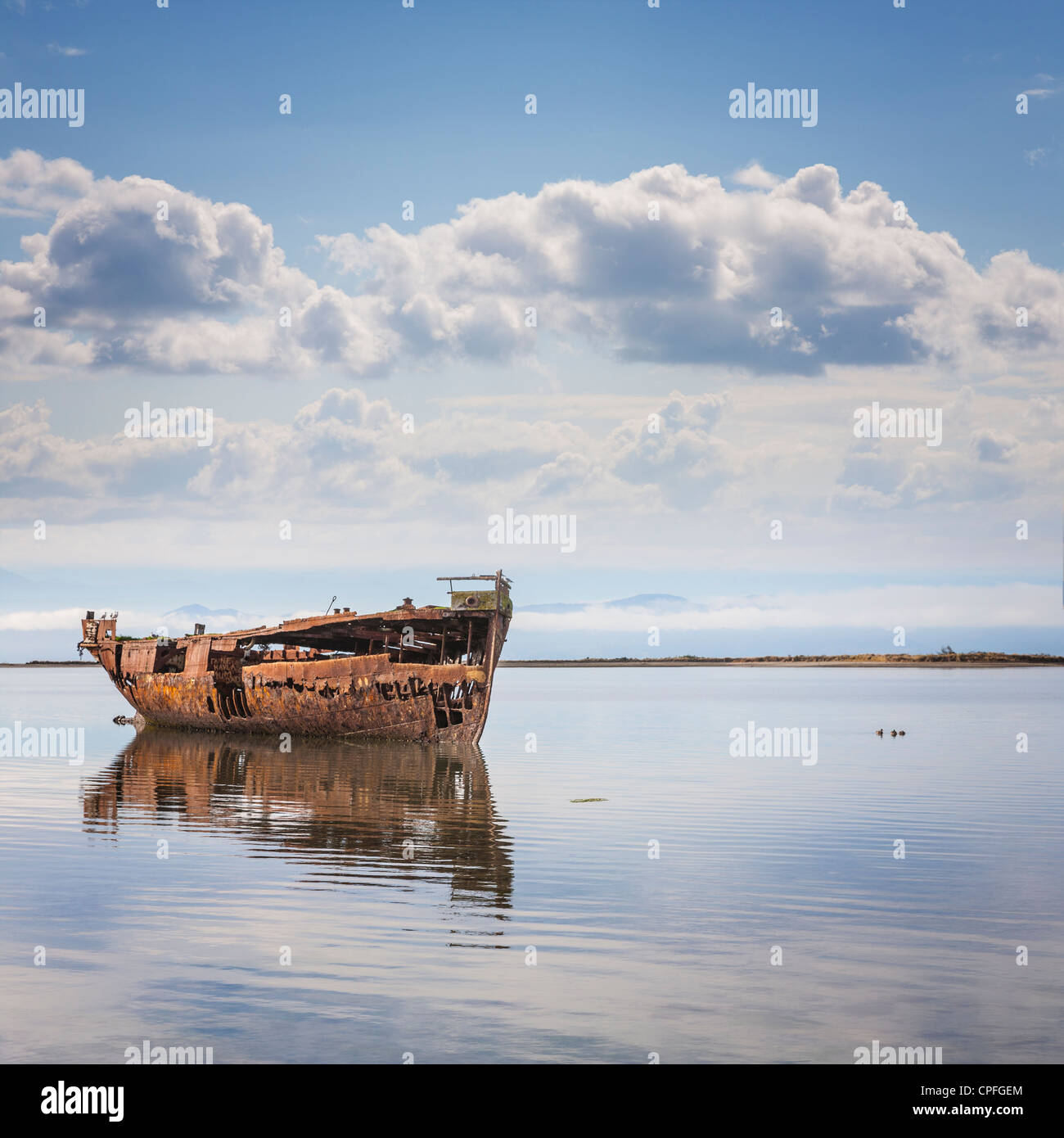 The hulk of the Janie Seddon slowly turning to rust in the bay at Motueka, Nelson, New Zealand. Stock Photo