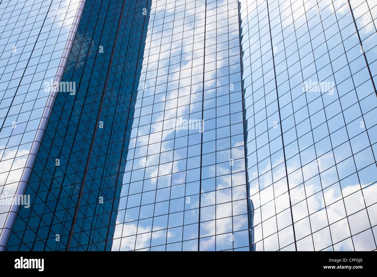 Clouds and sky reflected on the glass windows of the Hyatt Regency. Dallas, Texas. Stock Photo