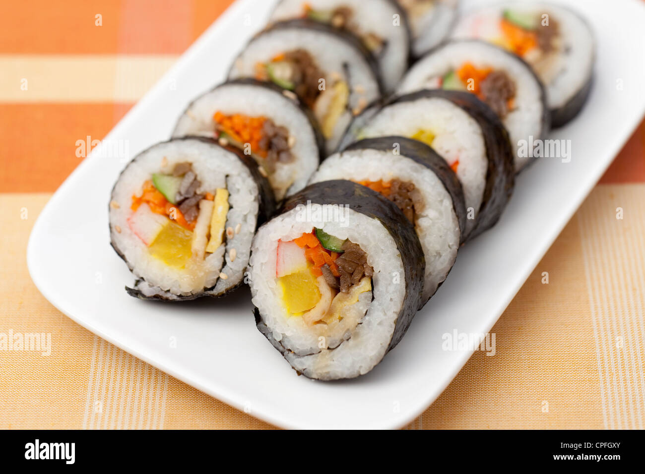 Gimbap, a Korean dish made from rice and other ingredients rolled in seaweed. Stock Photo