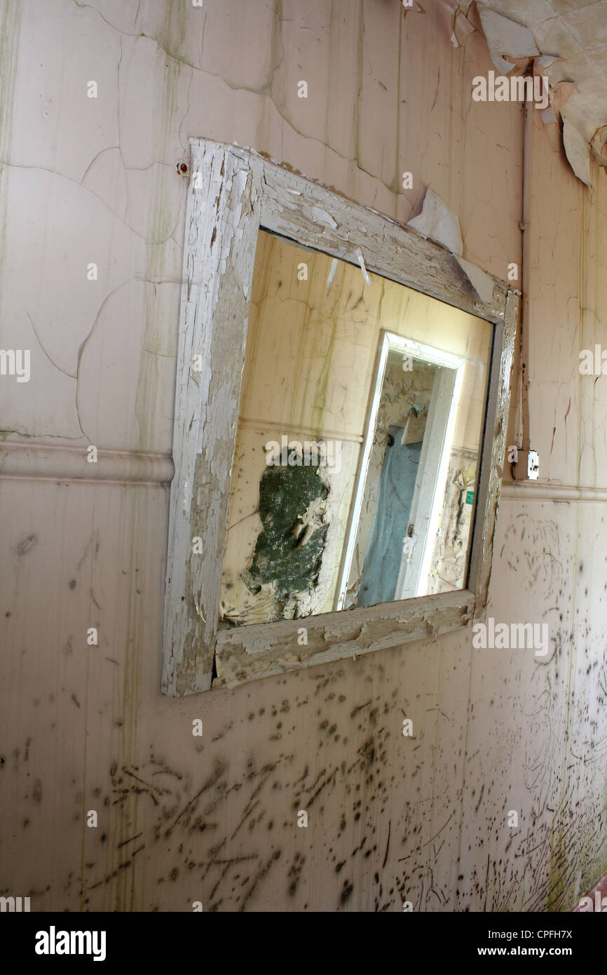 reflection in a mirror of abandoned building Stock Photo