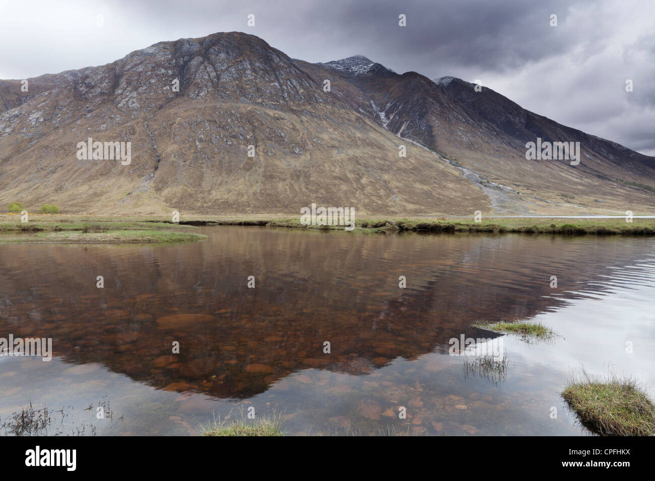 View of Ben Starav, one of the Scottish Munros, reflected in the loch. Stock Photo