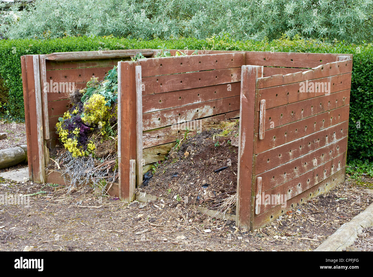 Large garden compost bins constructed of old timber Stock Photo Alamy