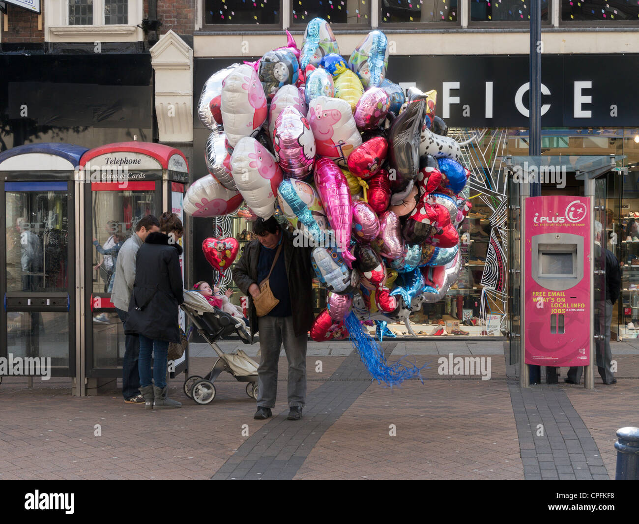 A colourful balloon seller in KingstonuponThames, London England