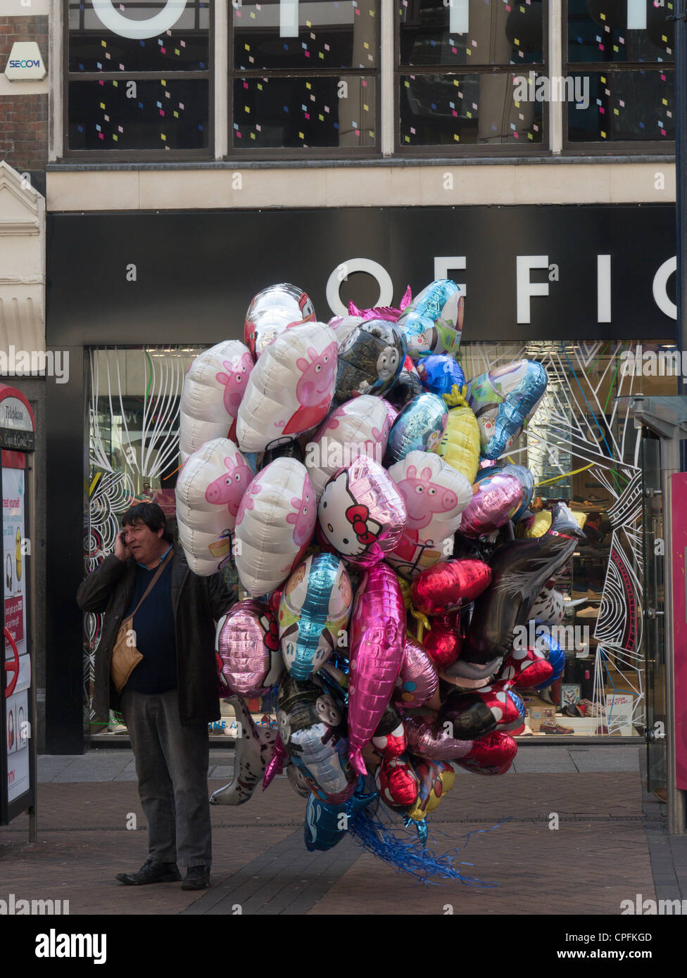 A colourful balloon seller in KingstonuponThames, London England