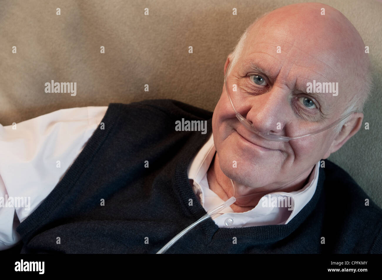 Portrait of an elderly man wearing oxygen nasal tube Stock Photo