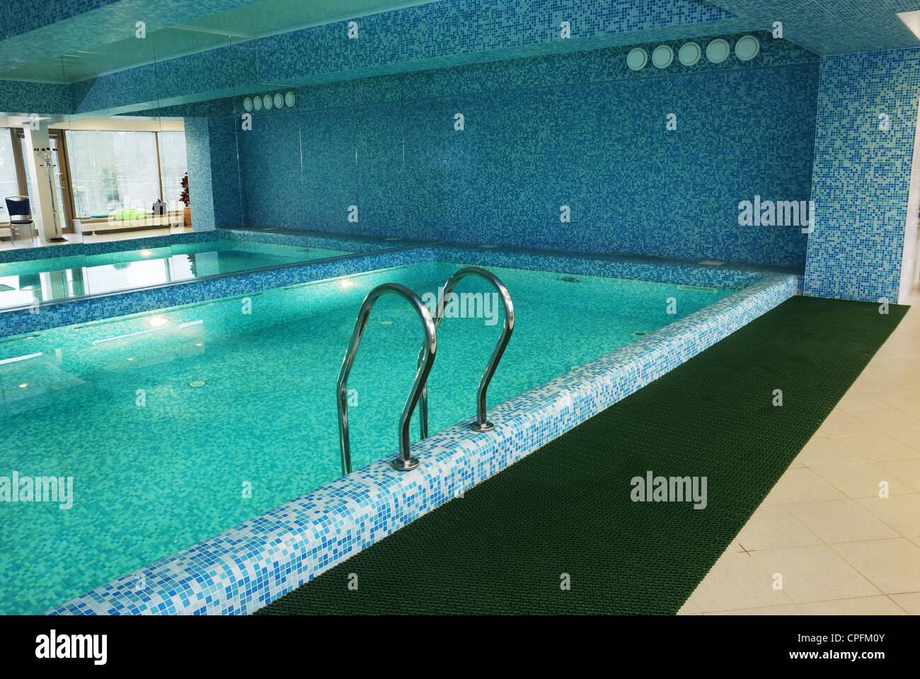 fine swimming pool with ladder indoor horizontal Stock Photo - Alamy