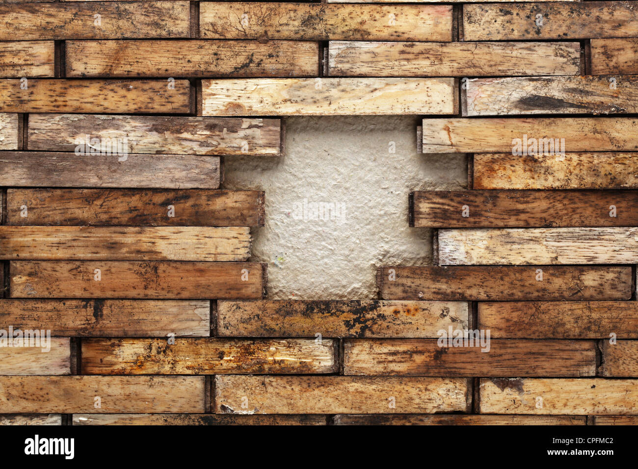 Hole in a wooden wall Stock Photo