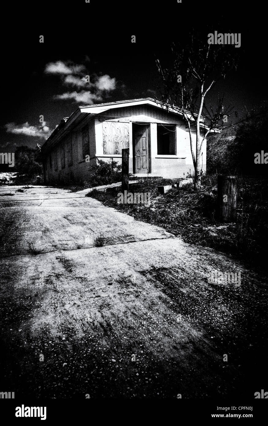 A creepy abandoned house in black and white Stock Photo