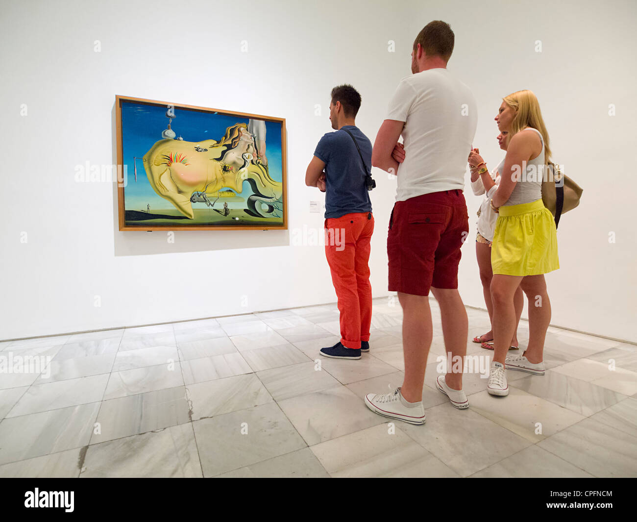 Visitors looking at Salvador Dali painting 'El Gran Masturbador' in the Reina Sofia modern art museum in Madrid, Spain Stock Photo