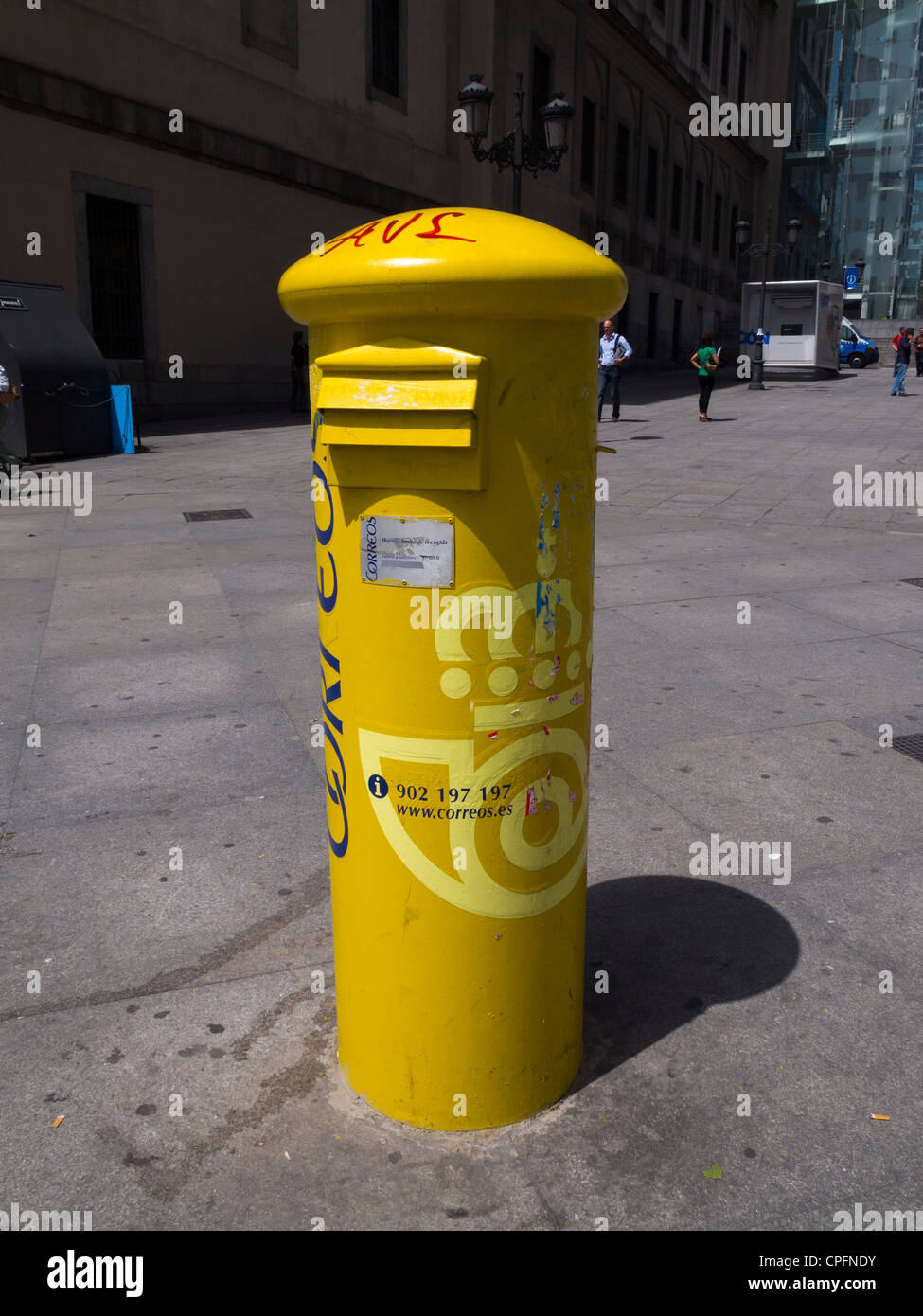 Yellow post office letterbox in Madrid, Spain Stock Photo