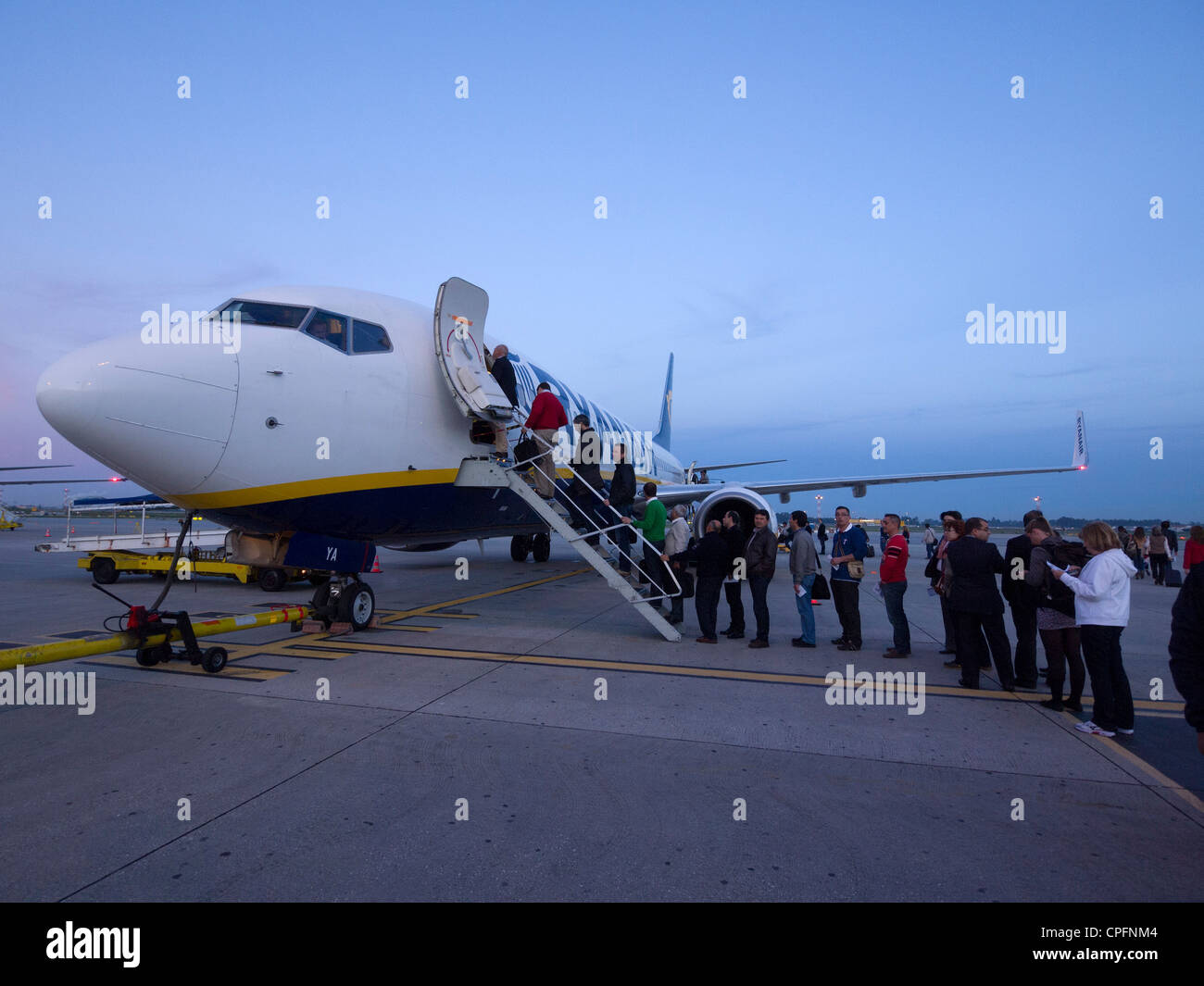 Passengers waiting to board a Ryanair airplane Stock Photo
