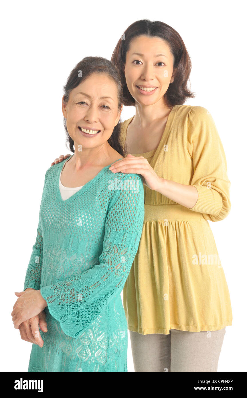 Two women standing together hi-res stock photography and images - Alamy