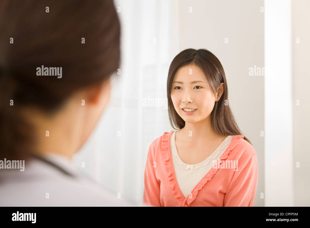 Young woman talking female doctor hi-res stock photography and images ...