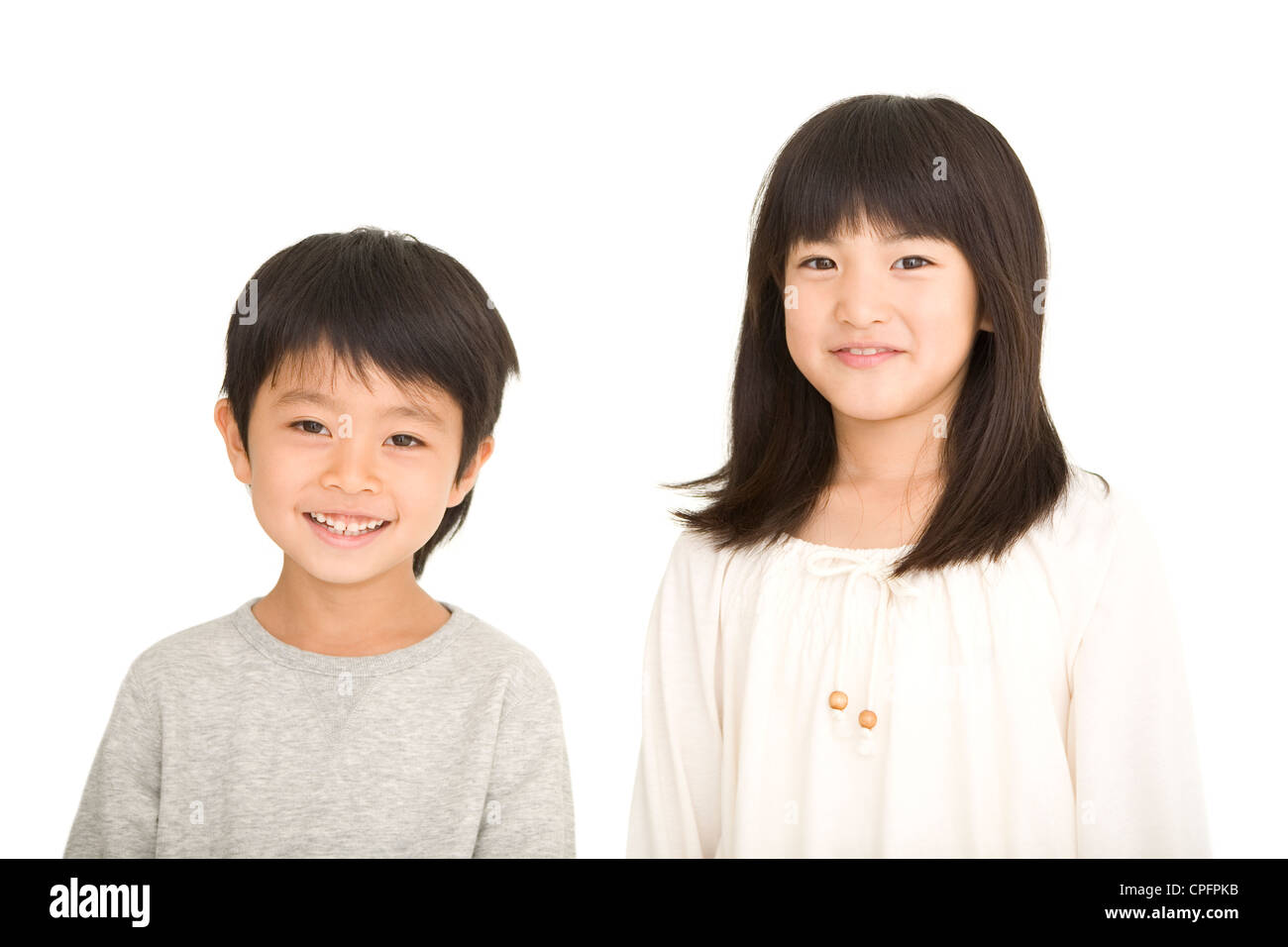 Boy and girl standing Stock Photo - Alamy