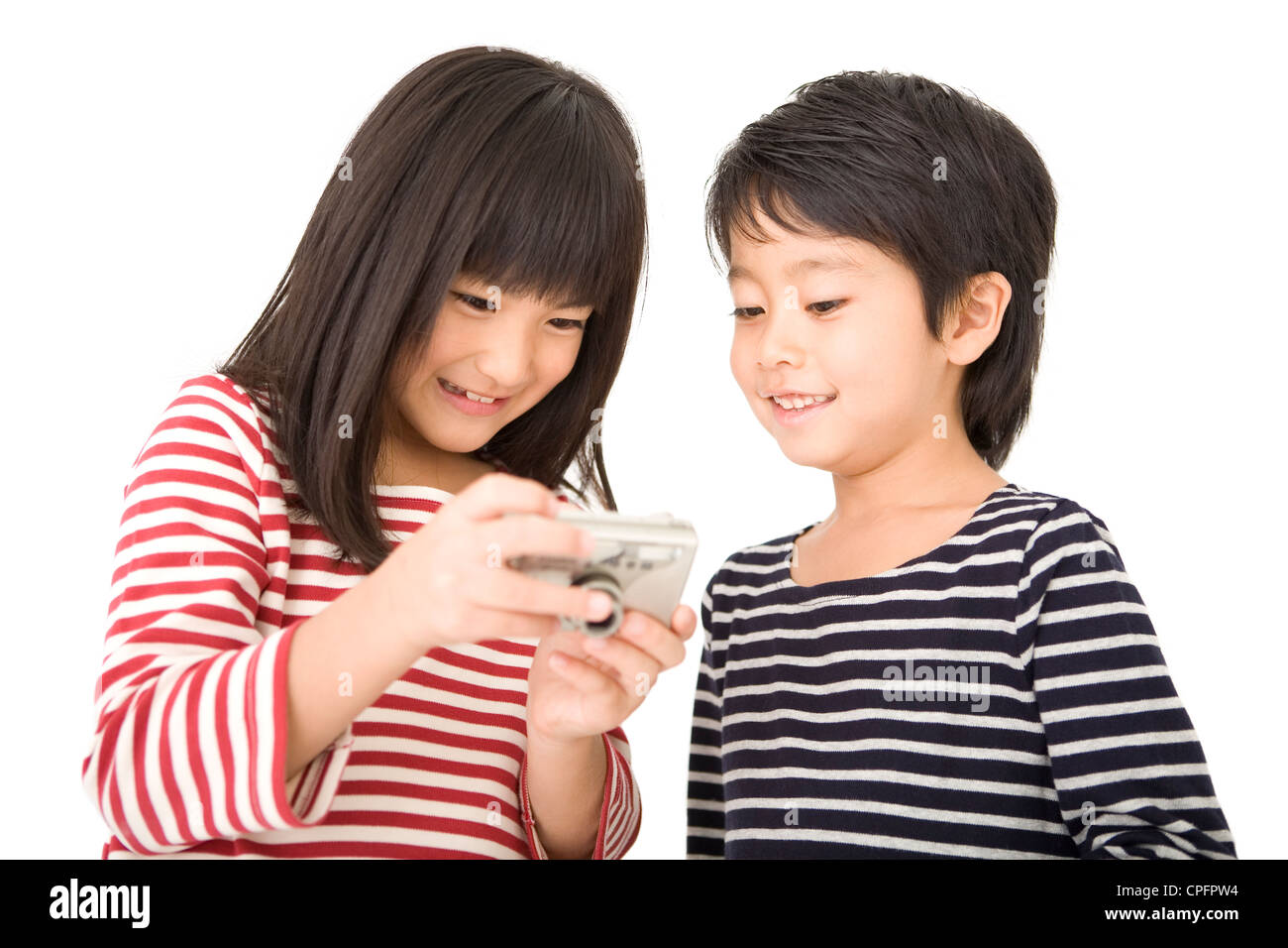 Boy and girl looking digital camera Stock Photo - Alamy
