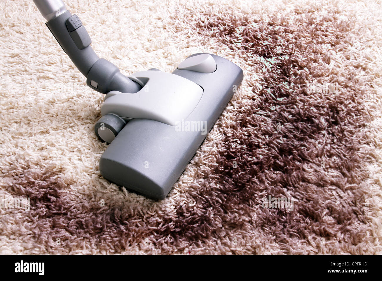 Vacuuming very dirty white carpet Stock Photo Alamy