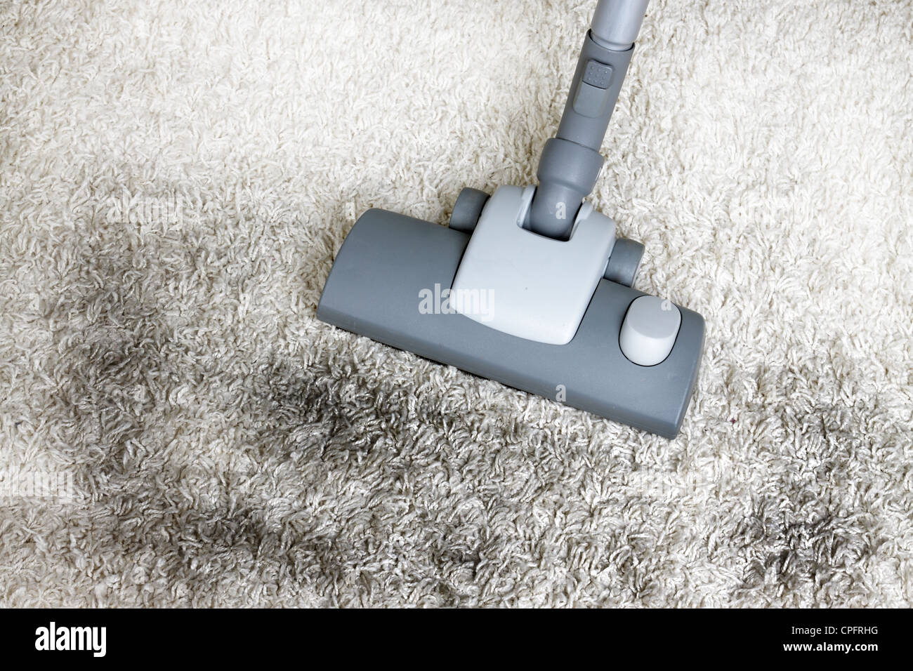 Vacuuming very dirty white carpet Stock Photo Alamy