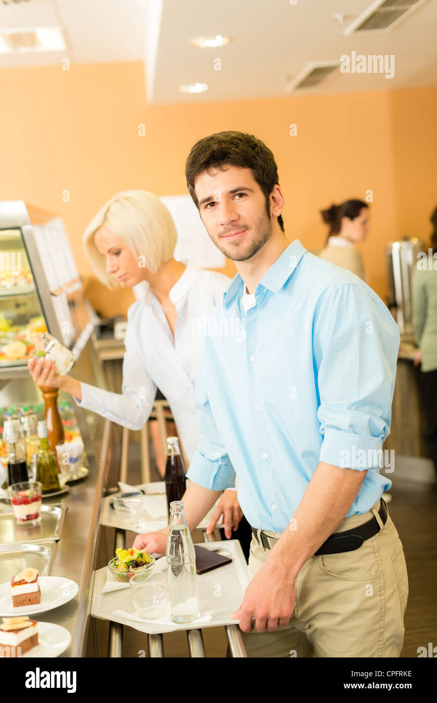 Young businessman at cafeteria hold serving tray canteen selfservice