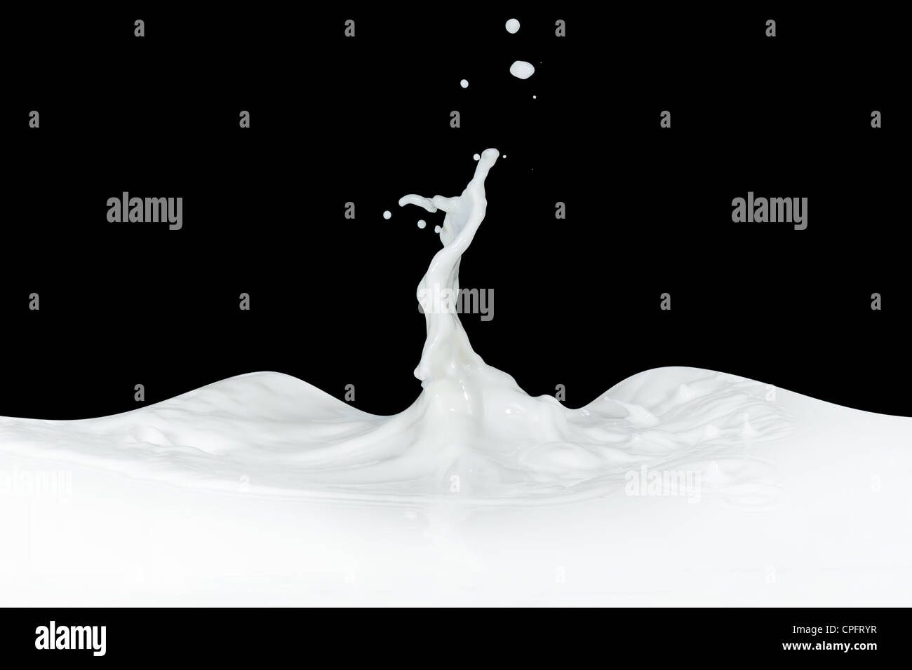 splashing milk isolated on black background Stock Photo - Alamy