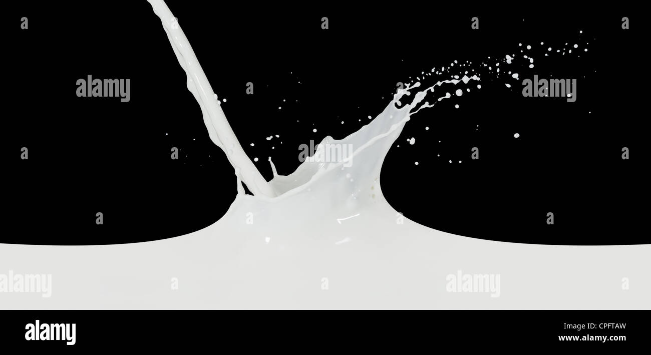 splashing milk isolated on black background Stock Photo - Alamy