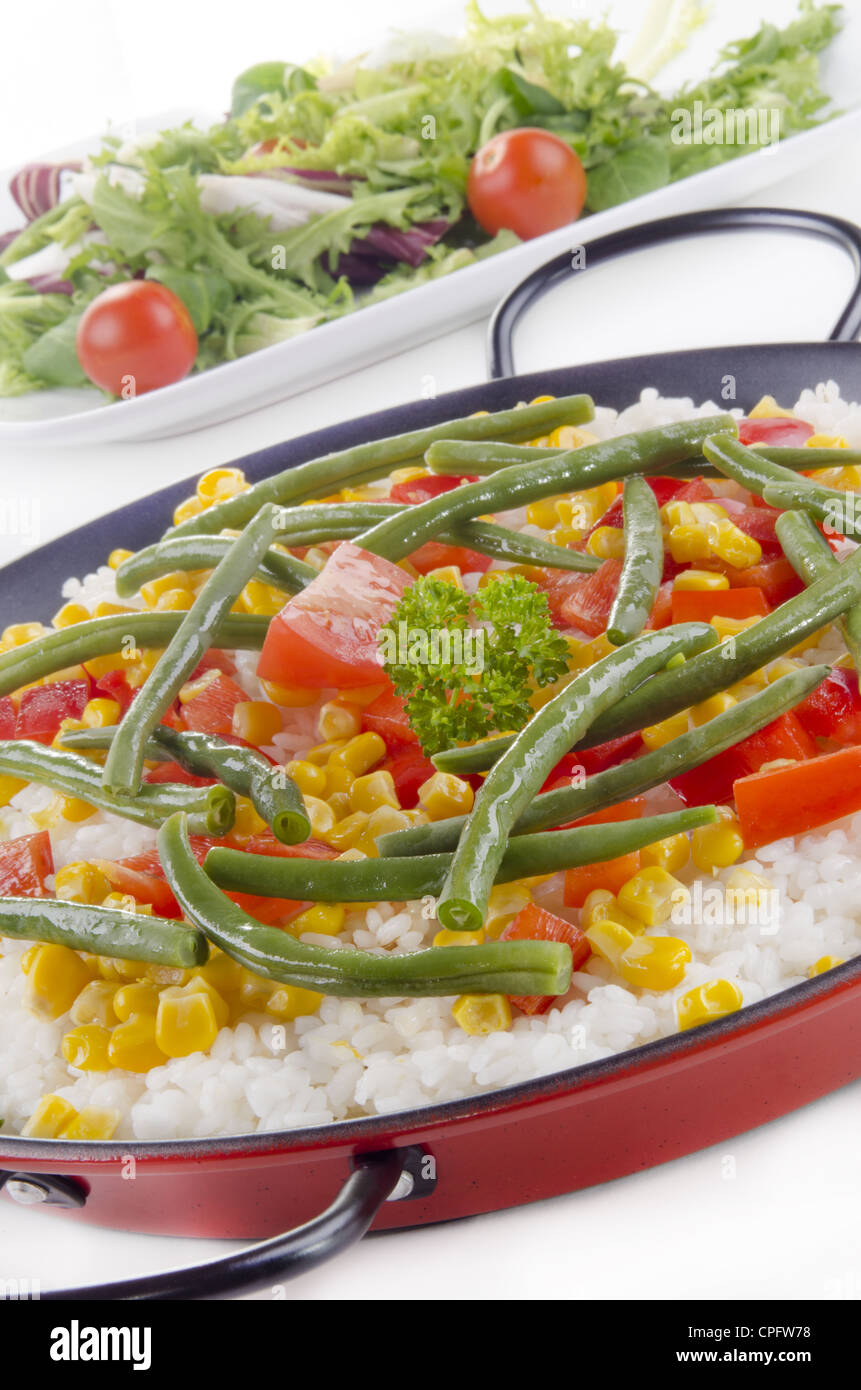 spanish vegetable paella with bell pepper, sweet corn and beans Stock Photo