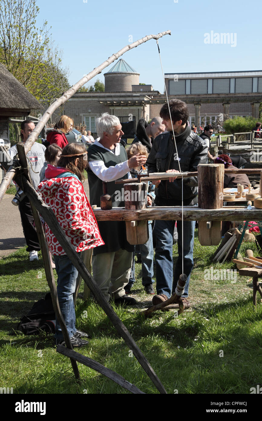 Craftsman demonstrating pole lathe Bede's World, Jarrow, North East England, UK Stock Photo