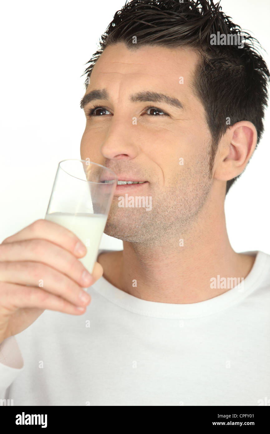 Man drinking glass of milk Stock Photo Alamy