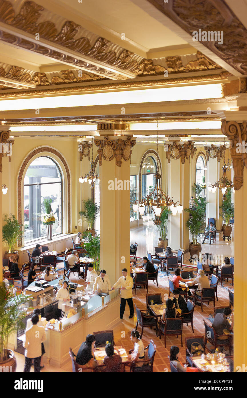 Balcony view of The Peninsula Hotel lobby during busy afternoon high tea time. September 2011. Stock Photo