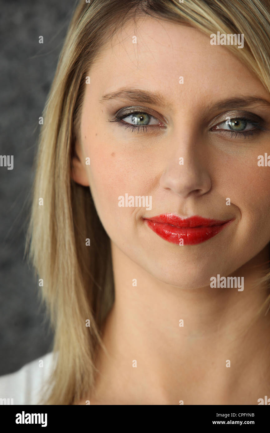 Head-shot of blond woman wearing red-lipstick Stock Photo
