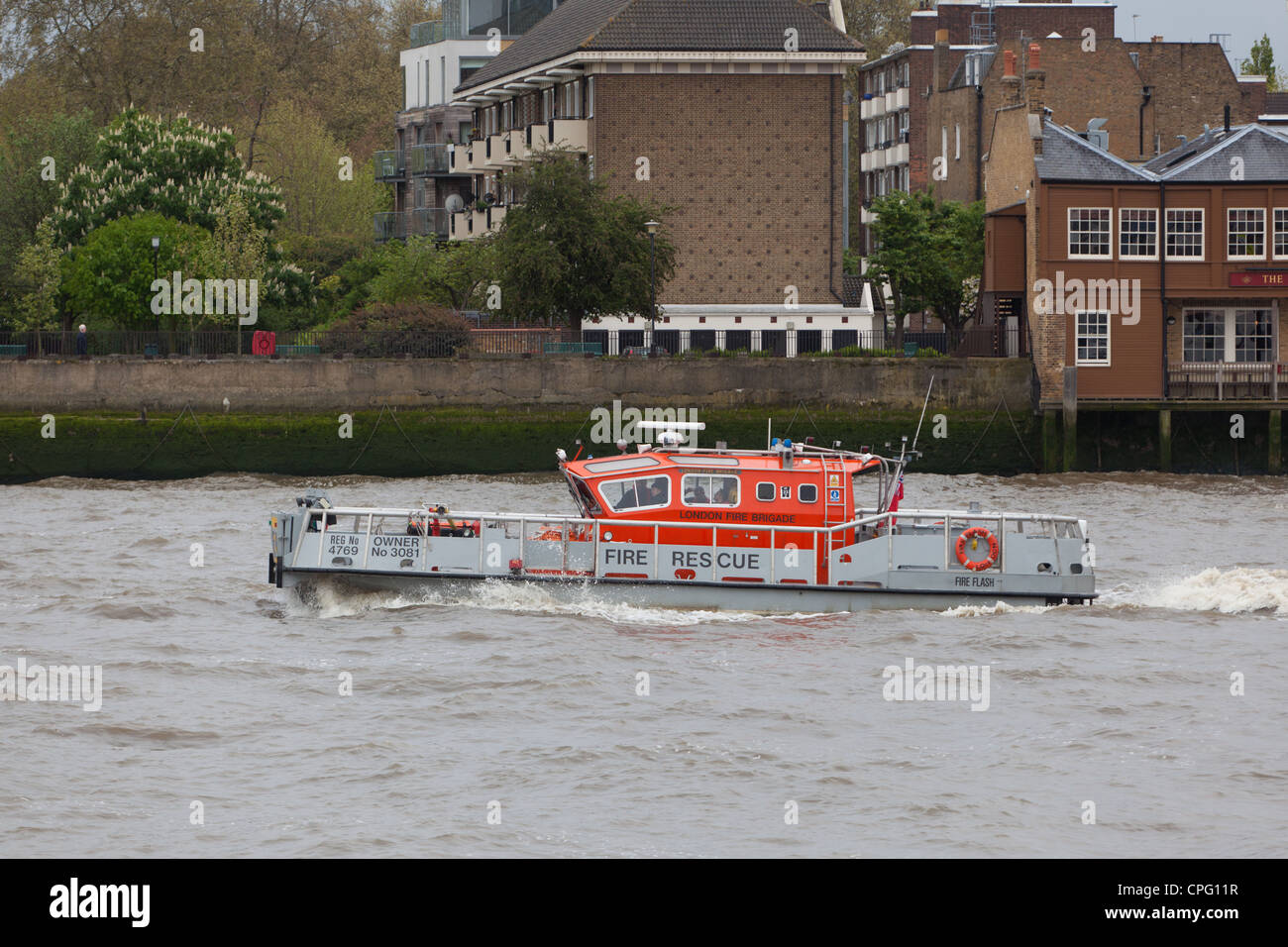 London Fire Brigade rescue boat patrolling on the River Thames, London Stock Photo