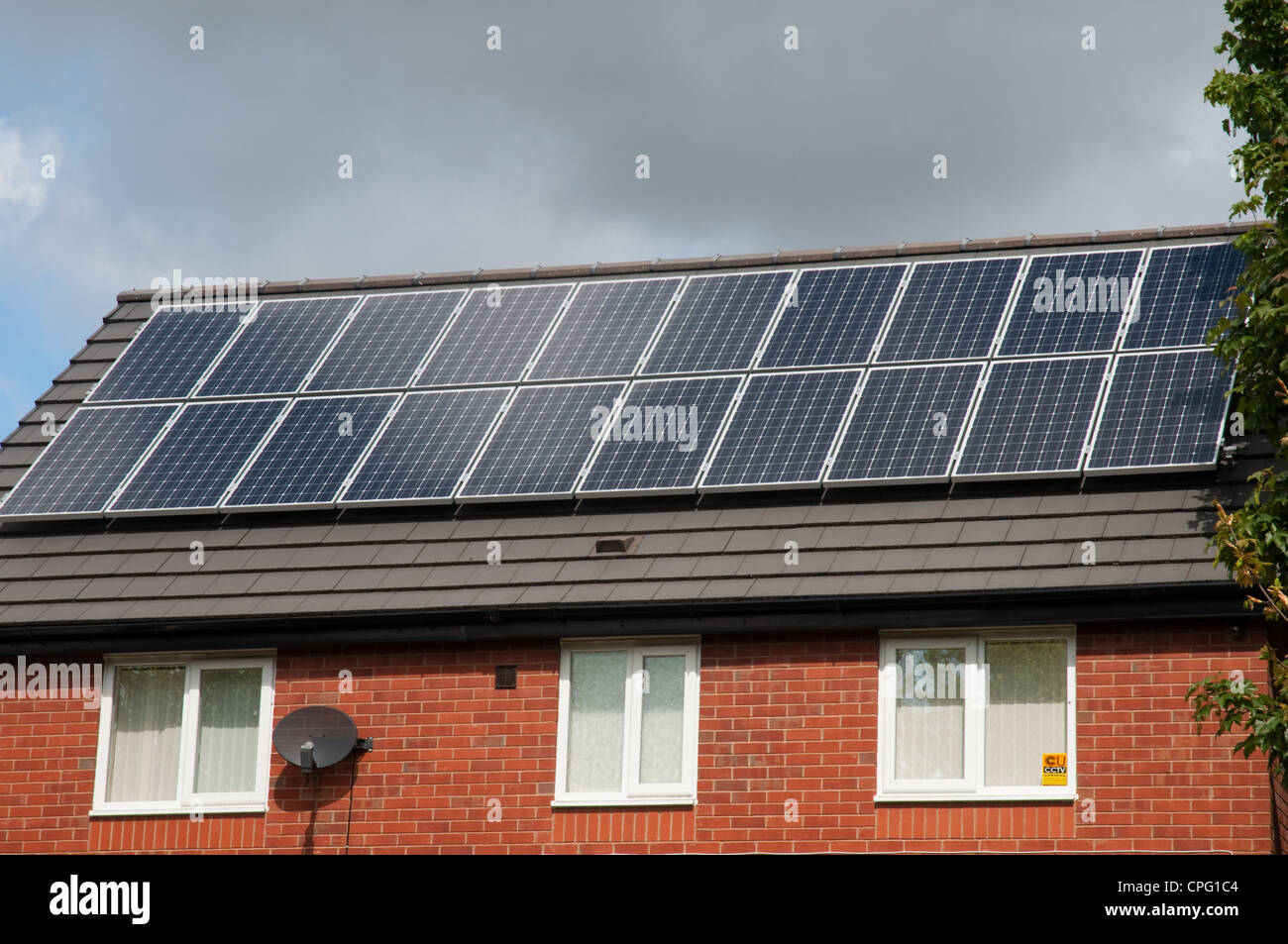 Solar panels on roof of residential property. Stock Photo