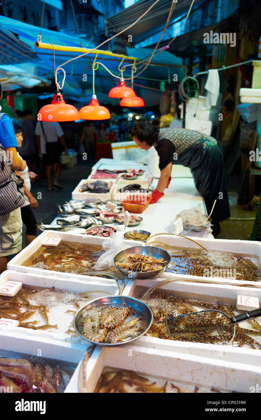 A fresh seafood vendor at an outdoor wet market in Central Hong Kong