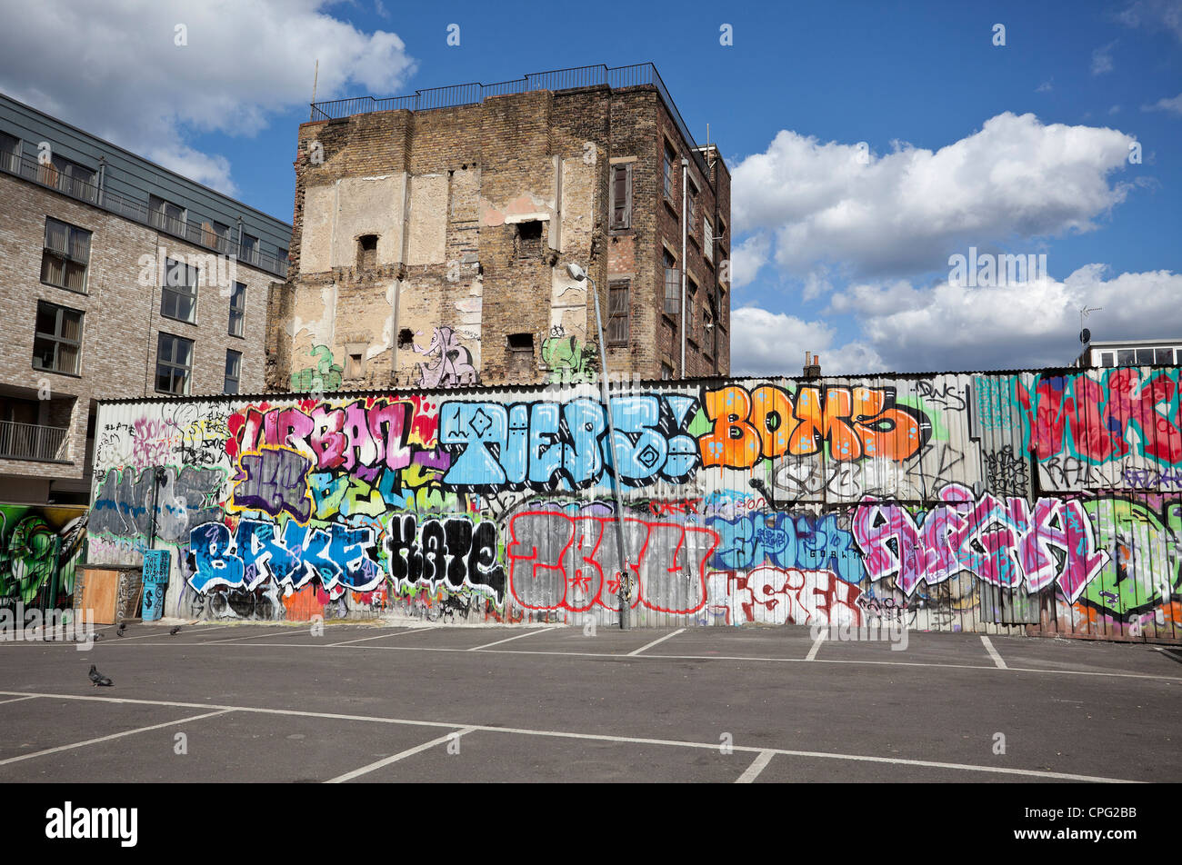 Graffiti on wall of empty car park, Shoreditch, London, England, UK. Stock Photo