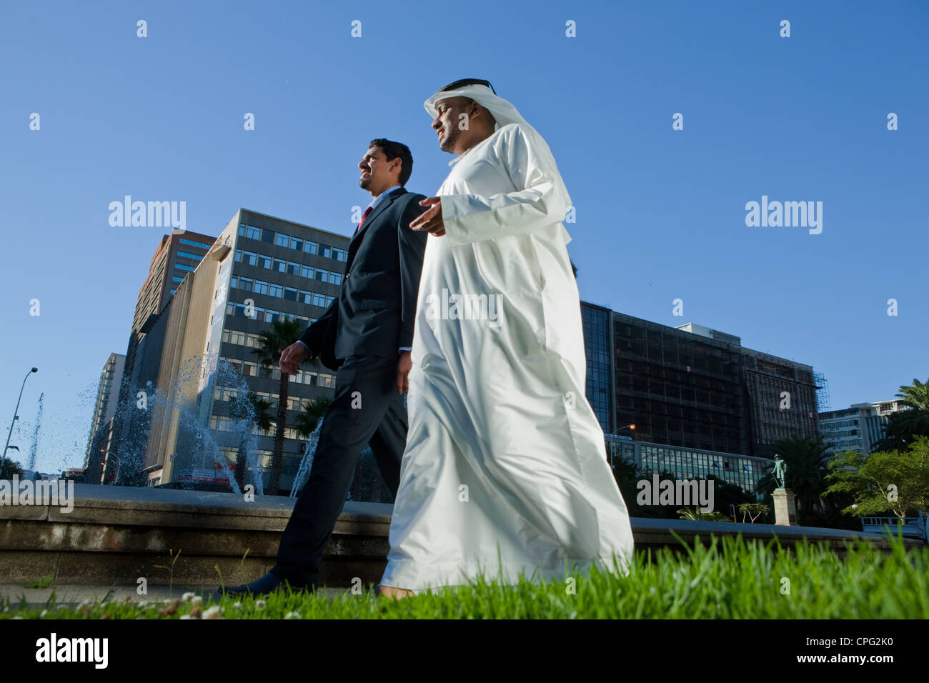 Two businessmen walking side by side hi-res stock photography and ...