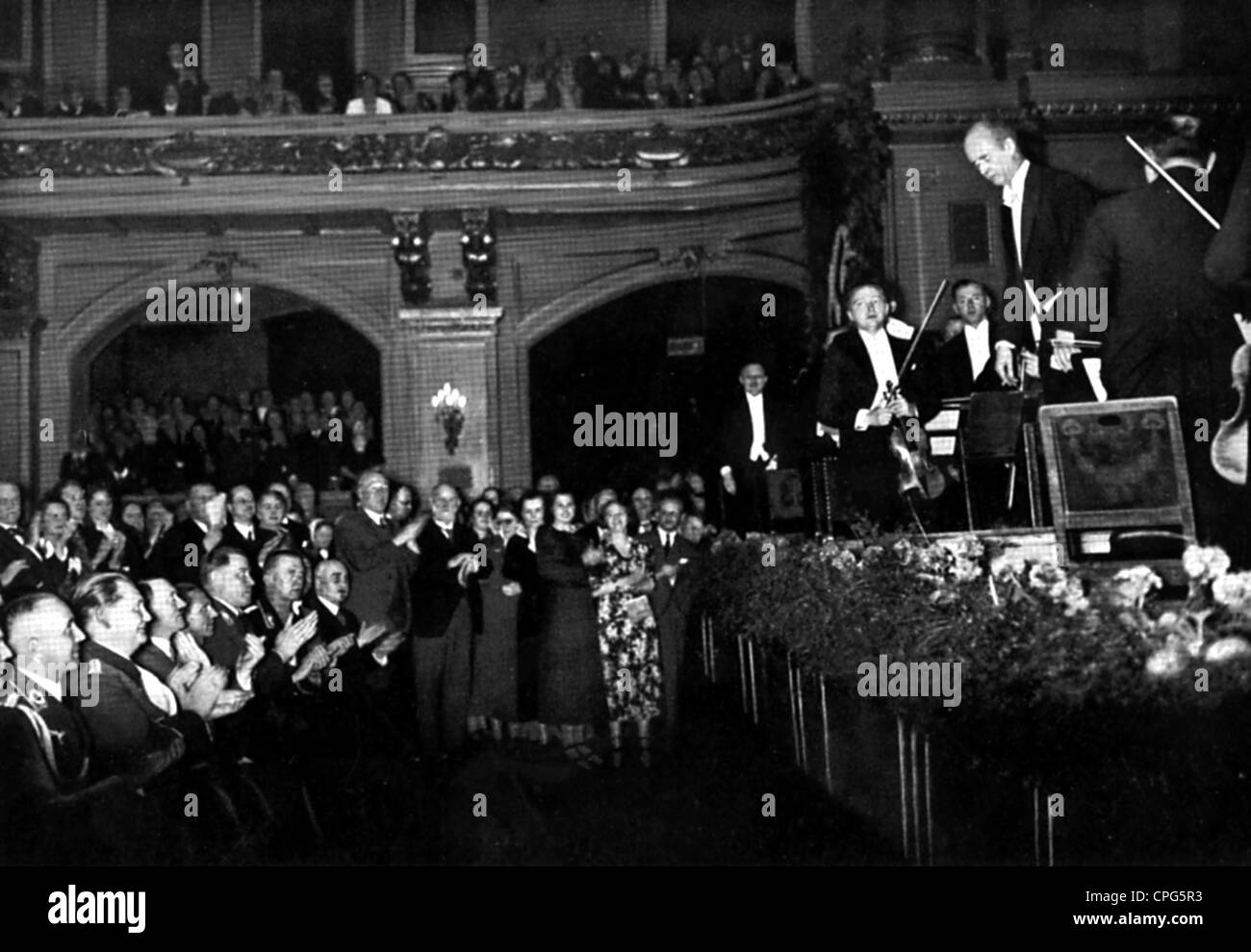 Furtwaengler, Wilhelm, 25.1.1886 - 30.11.1954, German musician (conductor, composer), half length, during of a concert of the Berlin Philharmonic Orchestra, among the audience: Goering, Hitler, Goebbels, 1935, Stock Photo