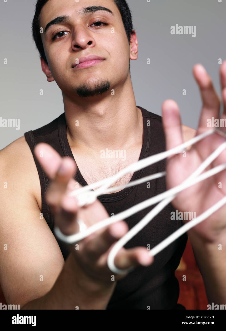young Adult playing With strings Stock Photo - Alamy
