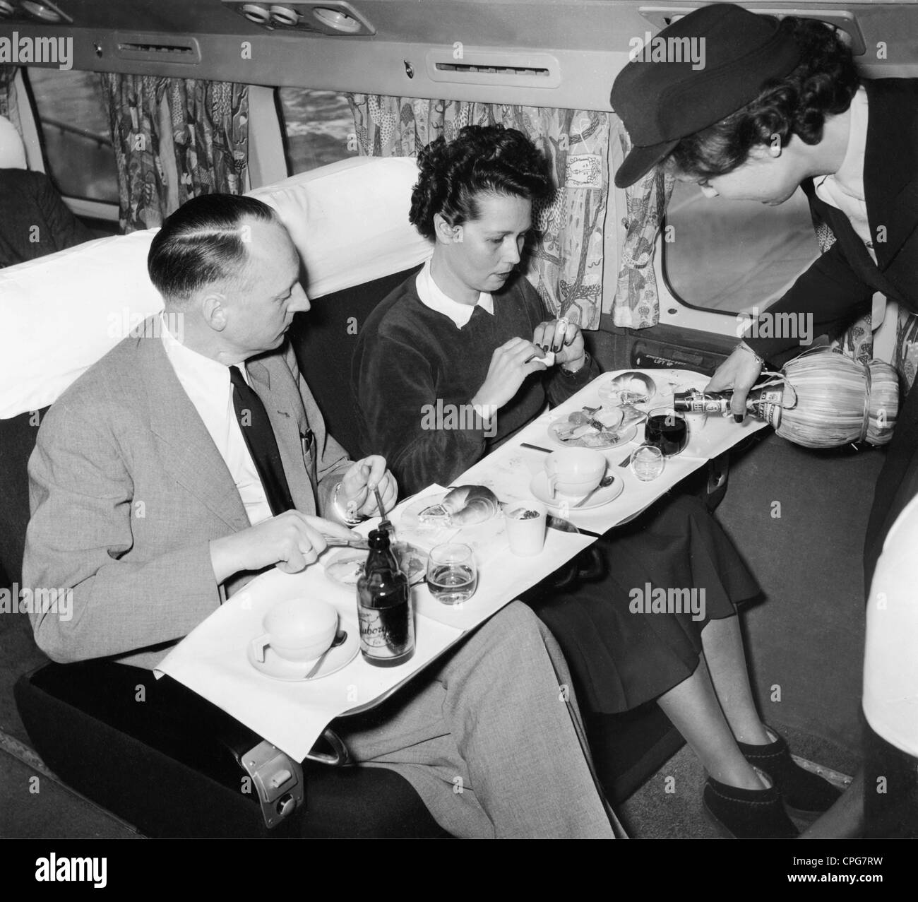 transport / transportation, aviation, airplane, interior, board service, stewardess is pouring wine, 1950, Additional-Rights-Clearences-Not Available Stock Photo