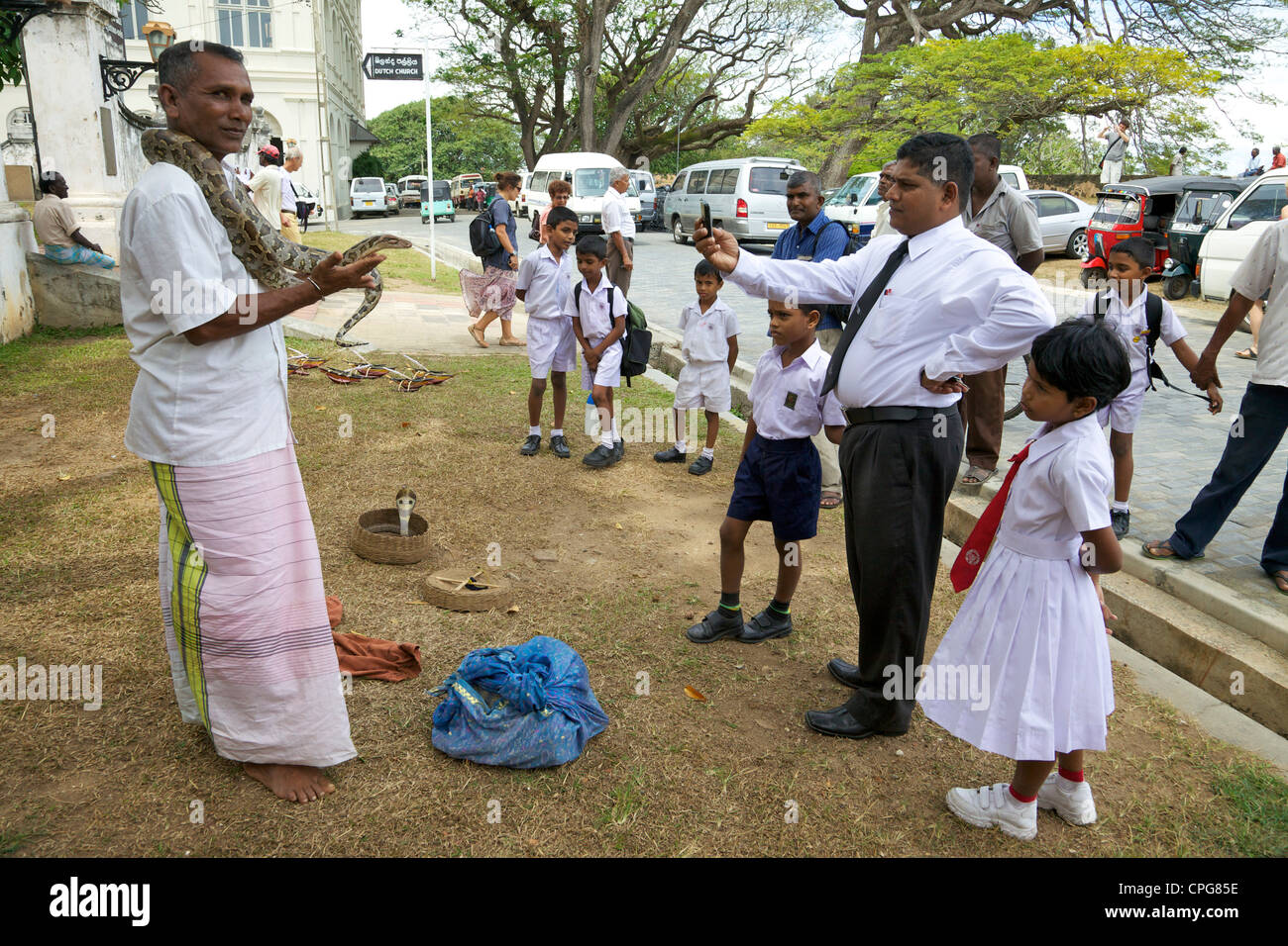 Sri Lankan audience watching snake charmer, Galle, Sri Lanka, Asia Stock Photo