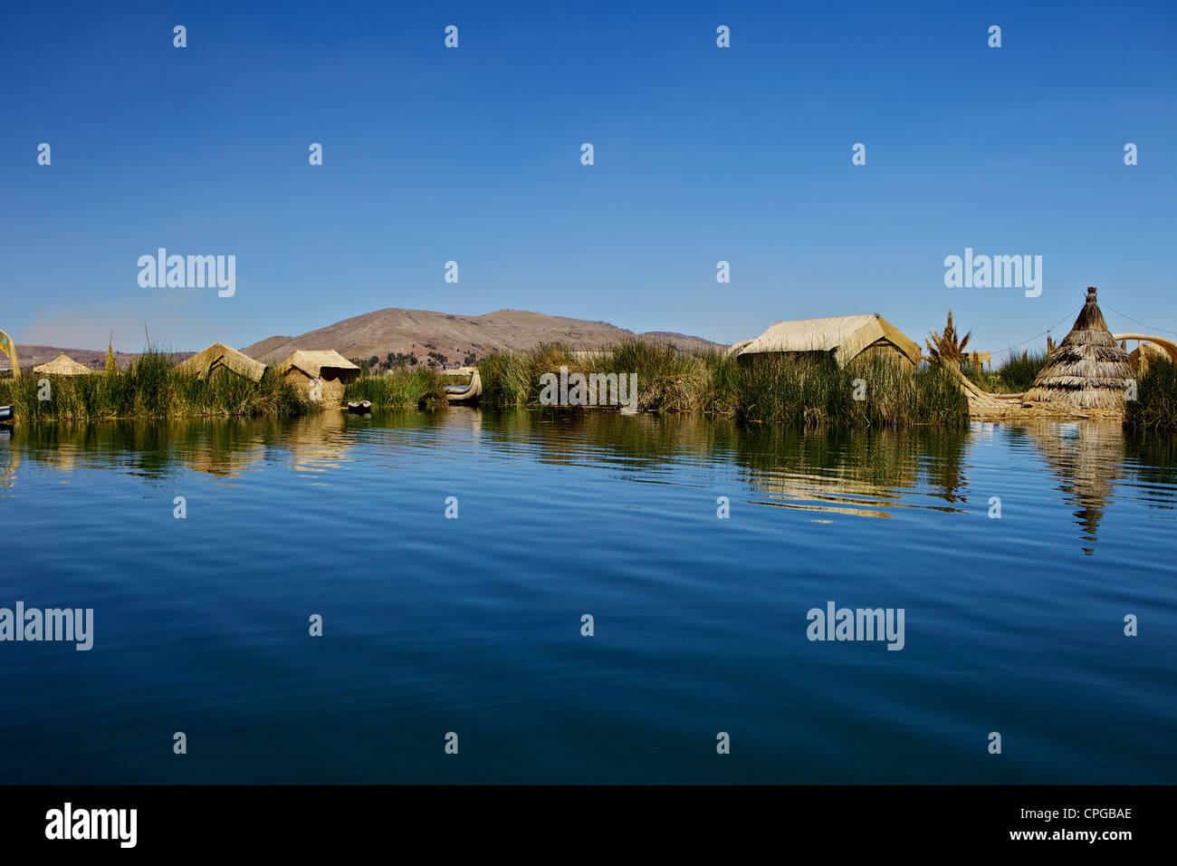 Floating islands of the Uros people, traditional reed boats and reed ...